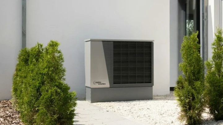Air conditioner outdoor unit beside a house