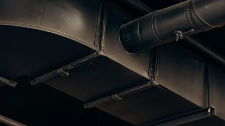 Air ducts running along a ceiling