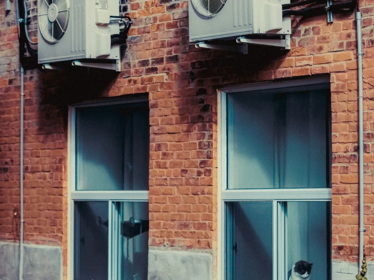 Brick row homes with outdoor HVAC units