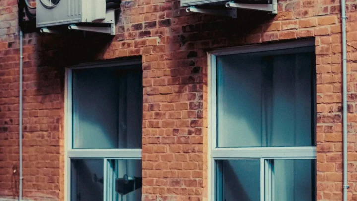 Brick row homes with outdoor HVAC units